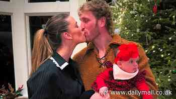 Logan Paul kisses fiancée Nina Agdal while cradling their baby girl Esmé in Christmas album