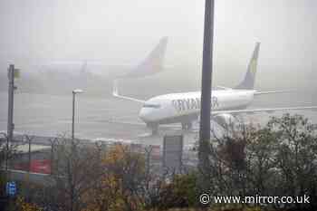 Travel chaos at Manchester Airport as dense fog causes major delays to flights