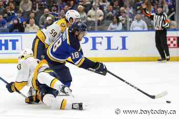 Thomas scores twice and the Blues beat the Predators 7-4