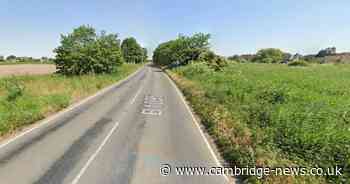 Van found on its roof in Cambridgeshire field next to road