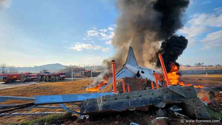 Plane veers off airport runway in South Korea and crashes, killing at least 23: report