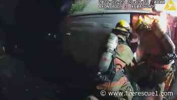 Police video shows Ore. firefighters rescuing woman in burning vehicle