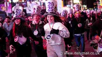 America ends 2024 in style! Thousands descend on Times Square to welcome in the New Year (despite fears of a washout)