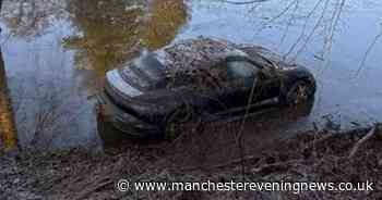 Porsche sports car frozen over after being abandoned and washed onto flooded golf course