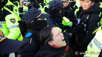 Supporters gather to block authorities from detaining impeached South Korean president