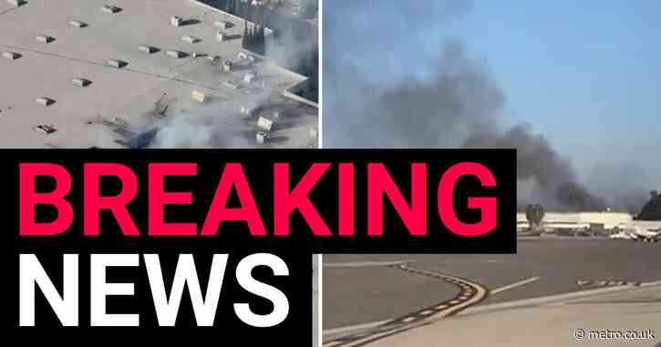 At least 11 injured as plane crashes into building near airport