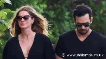 Pregnant Gisele Bundchen, 44, holds hands with boyfriend Joaquim Valente during beach stroll in Costa Rica