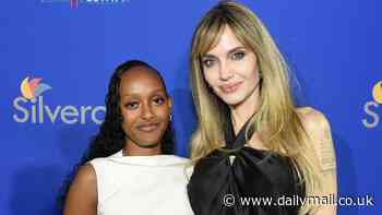 Angelina Jolie is supported by daughter Zahara at Palm Springs Film Festival after finalizing Brad Pitt divorce