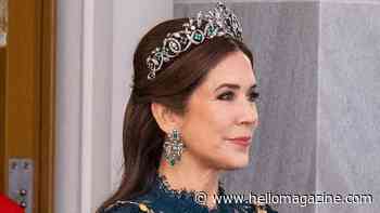 Queen Mary is a vision in glittering emerald tiara and sheer lace gown