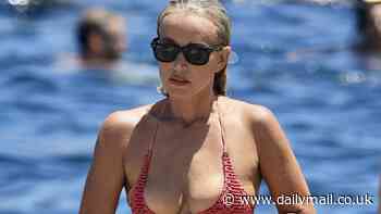 Jackie 'O' Henderson flaunts her slimmed down figure in fiery orange bikini ahead of her 50th birthday - as she enjoys a cold dip at Clovelly Beach with her bestie Gemma O'Neill