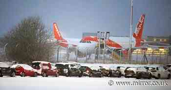 Heavy snow sparks travel chaos as airports closed amid Britain's -11C chill