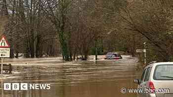 Elderly couple rescued after car trapped in flood