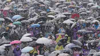 Thousands brave freezing conditions to protest against South Korean president as he faces arrest