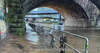 City centre river swells with path flooded after heavy rain, snow and ice hit Greater Manchester