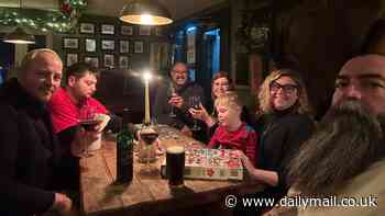 Drinkers snowed in at Britain's highest pub for third day are in 'high spirits' as they pass the time with board games and dance routines