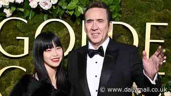 Nicolas Cage, 60, towers over his 5th wife Riko Shibata, 29, at the Golden Globes