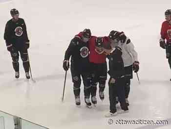 Senators defenceman Jacob Bernard-Docker helped off ice after suffering injury during club's skate