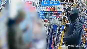 Terrifying moment masked robbers threaten shopkeeper with a WRENCH before scarpering with till