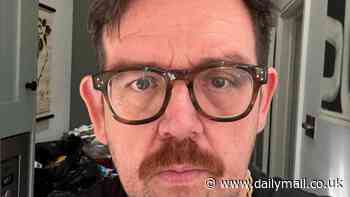 Nick Frost shows off his new look with glasses and moustache as he poses for selfie after stepping out of the BBC studios