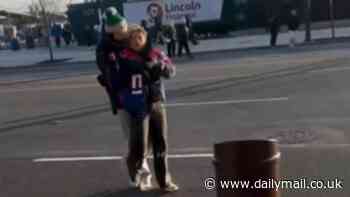 Young Eagles fans brutally taunt female Giants supporter after game in Philadelphia