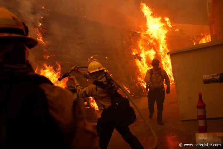 Photos: Palisades fire erupts as thousands flee their homes