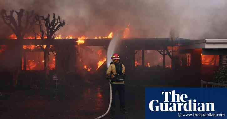 Fast-moving wildfire destroys homes as strong winds hit southern California