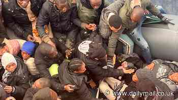 Miracle on the high seas: Incredible moment rescuers find newborn baby on packed migrant boat in the Atlantic minutes after mother gave birth during treacherous crossing to Canary Islands