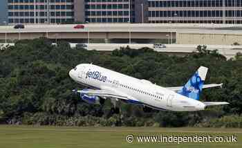 JetBlue passenger arguing with girlfriend rips open emergency door and tries to jump out