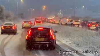 Snow chaos hits the South as cars skid on ice in rush hour blizzards with Met Office issuing amber and yellow weather warnings and temperatures set to plunge to -12C