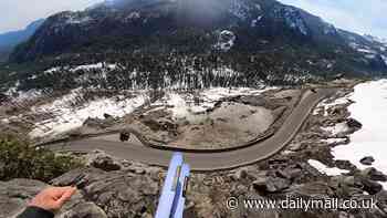 Jaw-dropping moment daredevil skier whizzes off huge cliff and over Tahoe highway