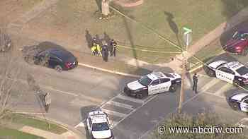 Man waving a gun shot by Dallas police officers Tuesday