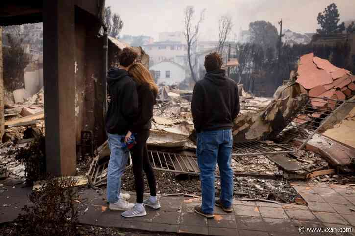 Wildfires burn out of control across Los Angeles area and kill 5 as thousands flee homes