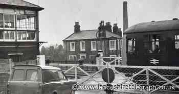 Level crossing gates closed at Brierfield Station as train arrived