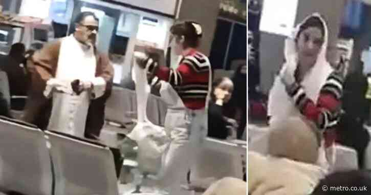 Brave woman pulls off mullah’s turban to use as hijab during airport confrontation