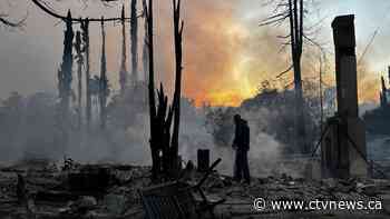 Firefighters battle to control devastating Los Angeles wildfires as ferocious winds calm somewhat