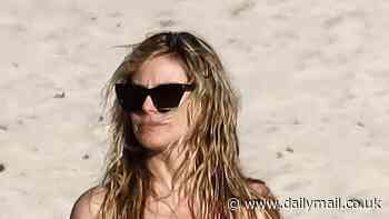 Heidi Klum goes topless on the beach in St. Barts with husband Tom Kaulitz after his brother is evacuated in LA fire