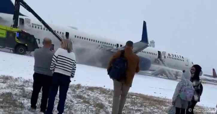 Over 200 plane passengers evacuate on slides and four injured after takeoff aborted