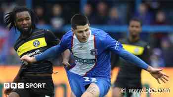 Wigan sign Carlisle defender Mellish