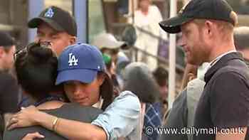 Harry and Meghan unite for victims of deadly LA inferno: Sussexes' visit to relief centre is first time they been seen together in public for five months