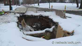 Water main break opens large hole in Hyde Park neighborhood