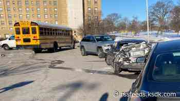 School bus with 11 children on board crashes into car after sliding on ice