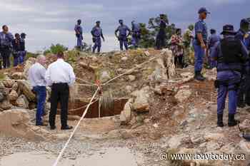 At least 100 illegal miners have died while trapped in a South African mine, group says