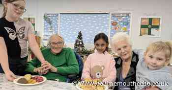 Care home residents enjoy afternoon tea with children