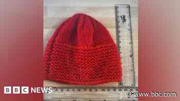 Red knitted hats for newborns who need extra care