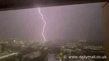 Severe thunderstorms smash Australia's east coast leaving one man dead and shutting down Sydney Airport - as 100,000 homes without power amid urgent warning over dangerous winds, lightning and hailstones