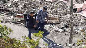 Emotional Mel Gibson surveys the smoldering remains of his Malibu house that is now just a heap of ashes that 'would fit into an urn'