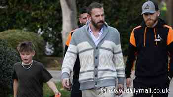 Ben Affleck adopts a security dog and takes it on a walk around his Brentwood neighborhood with son Sam