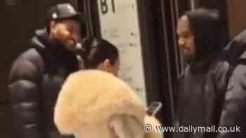 Kanye West's wife Bianca Censori covers up in furry white coat as they visit Azabudai Hills in Tokyo