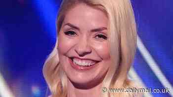 Dancing On Ice host Holly Willoughby shows off her incredible figure in a racy black strapless gown but some fans compare the dress to 'gaffer tape'