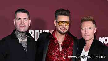 Boyzone's Ronan Keating, Keith Duffy and Shane Lynch reunite at premiere of their docuseries without former bandmate Mikey Graham - after not speaking to reclusive star in five years